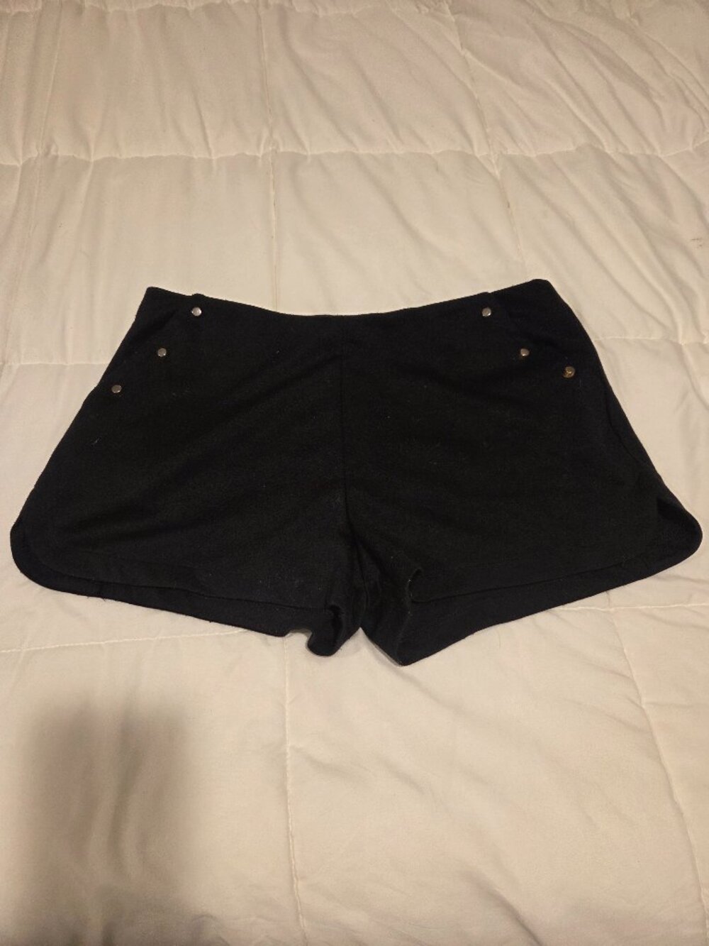 Black knit shorts with gold hardware